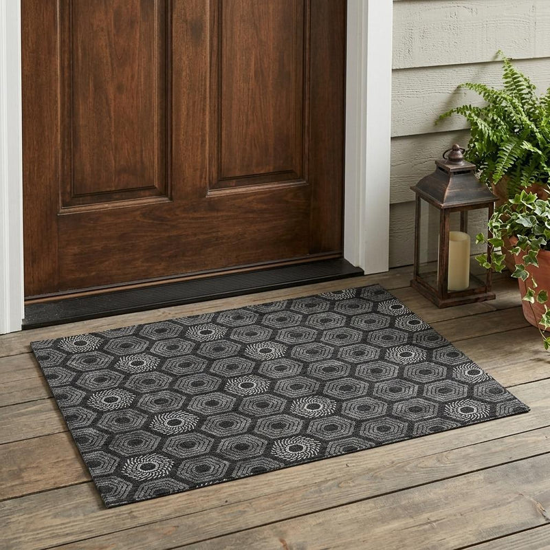 Black and gray geometric area rug with hexagon and circular medallion design