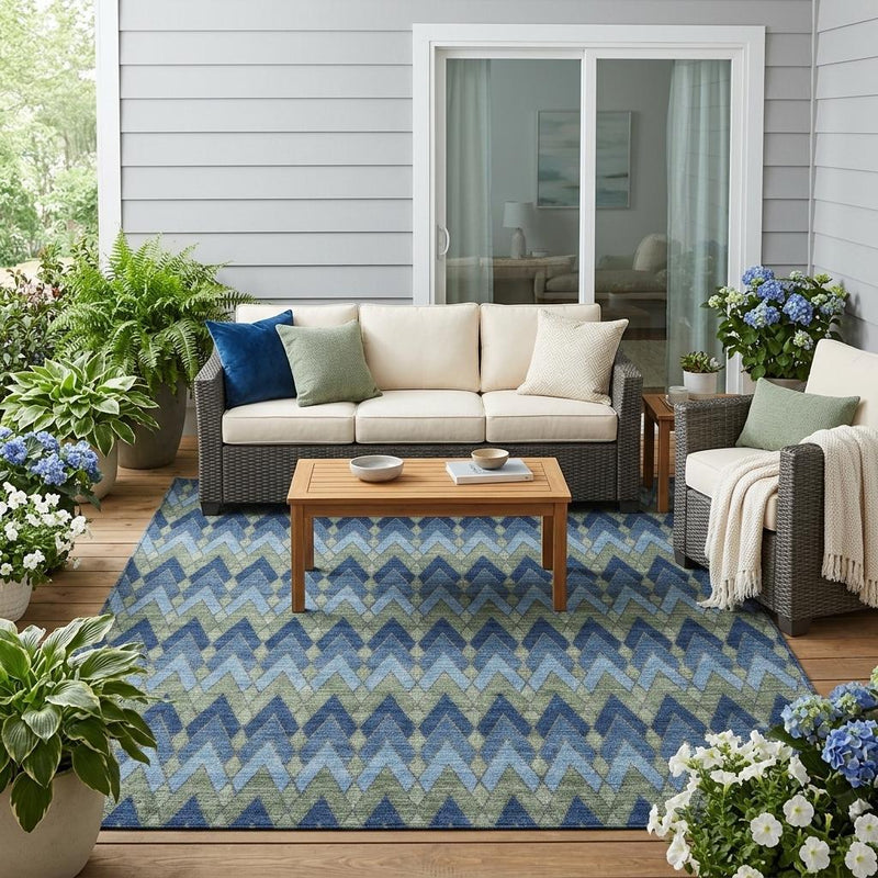 Blue and green chevron geometric area rug on the floor, indoor/outdoor use