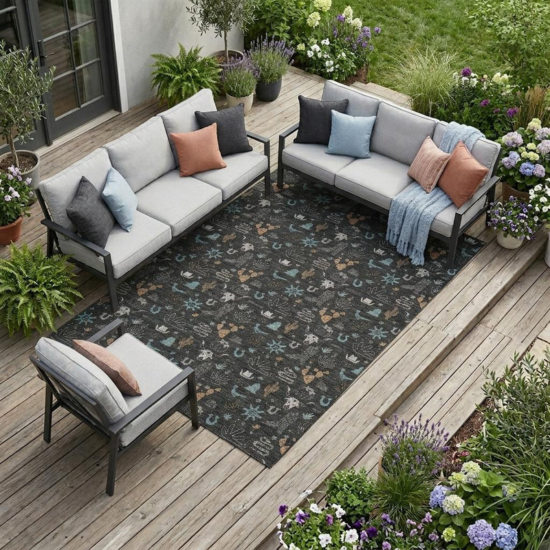 Black indoor outdoor area rug with teal cactus pattern, shown on an outdoor patio