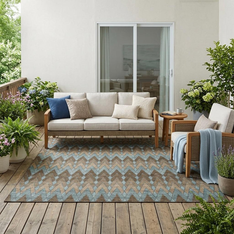 Outdoor area rug with blue and brown geometric zigzag chevron pattern