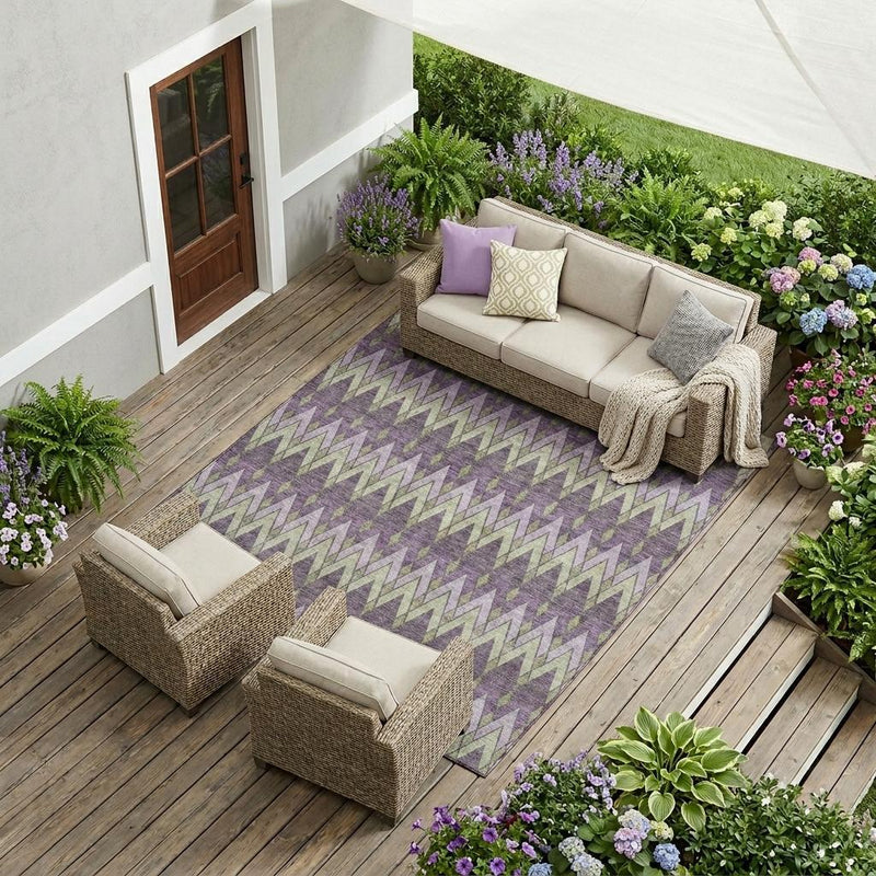 Purple and plum geometric chevron area rug laid out indoors or outdoors