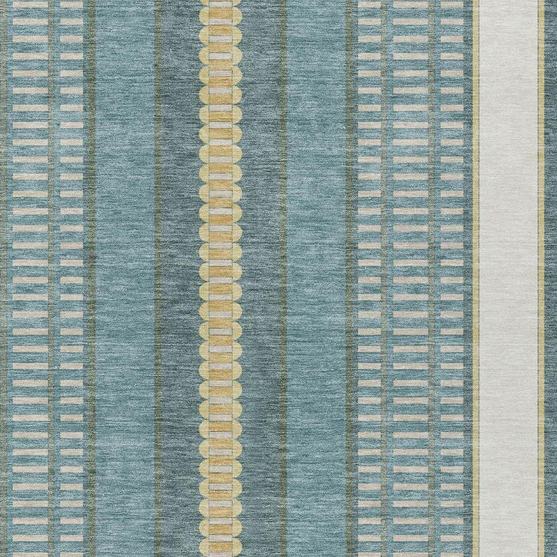 Teal blue area rug close-up with gold dotted center stripe and vertical grid texture