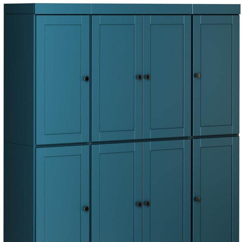 Teal blue cabinet with four upper and lower door panels, black knobs