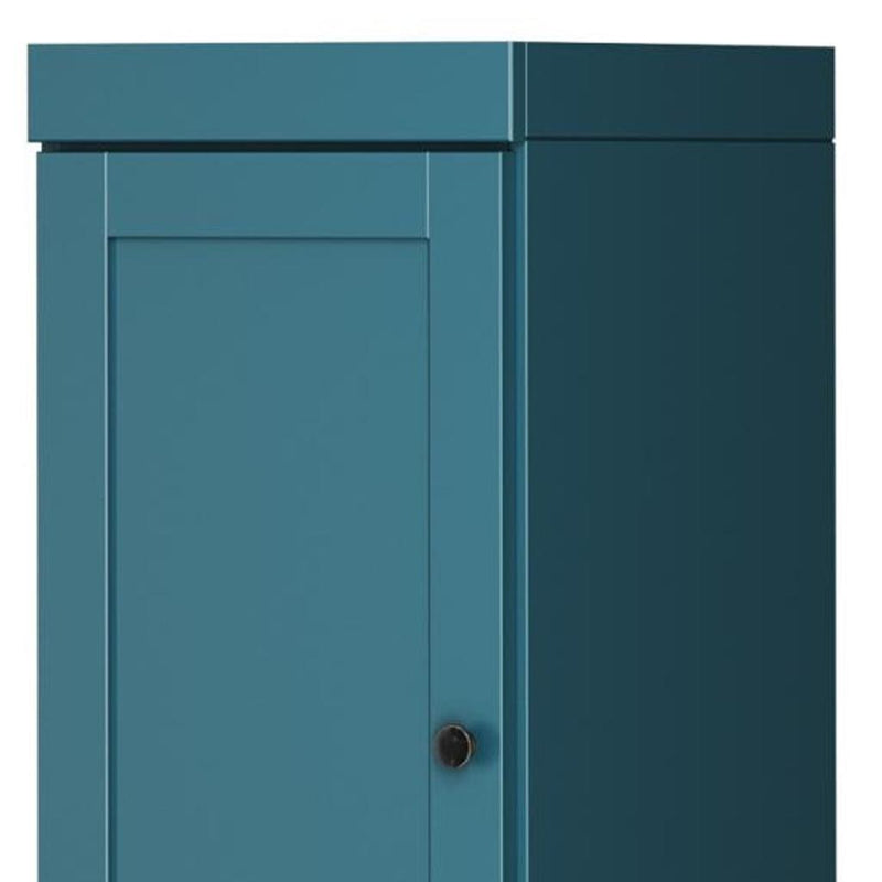 Teal blue cabinet door with round knob and vertical frame trim