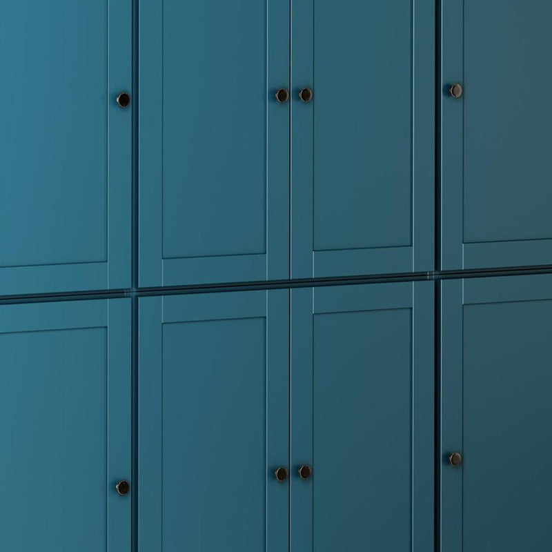 Teal blue cabinet doors with round knobs and double-hinge handles, solid wood