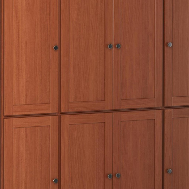 Brown wood pantry cabinet front with paneled doors and blue-gray metal knobs