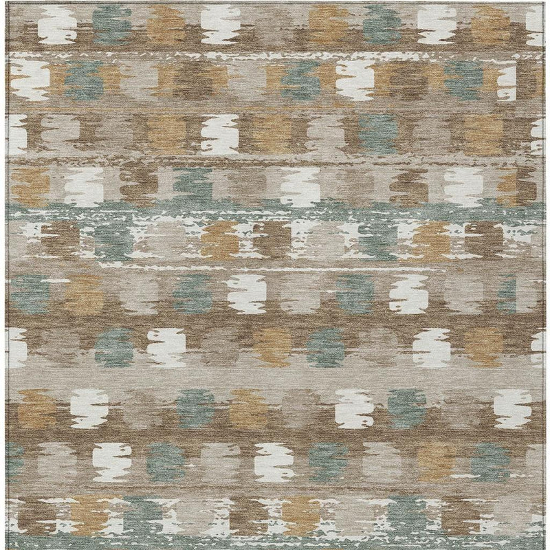 Rectangular area rug with brown and aqua abstract distressing and scattered ivory block accents