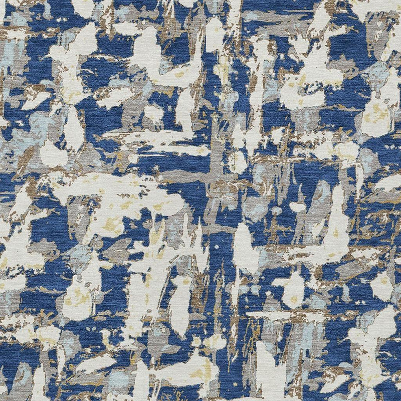 Abstract area rug pattern with blue and cream distressed overlapping shapes.