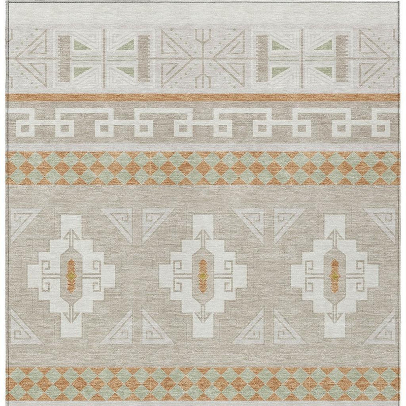 Ivory and green tribal washable area rug with geometric borders and central medallion motifs.