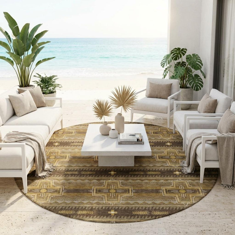 Round tribal area rug in brown and tan under indoor outdoor seating area