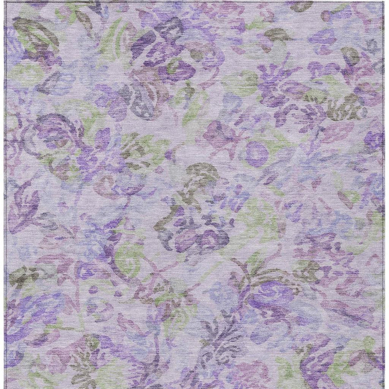 Lavender floral area rug with purple and green abstract vine-like motifs and border