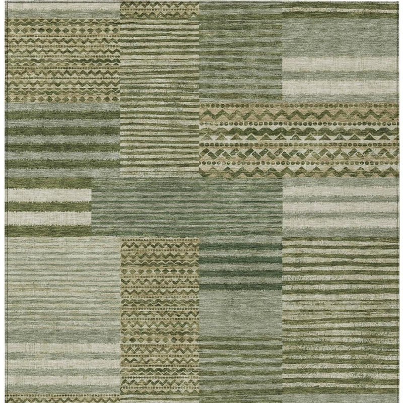 Green and sage area rug with multicolor stripes, blocks, and woven texture