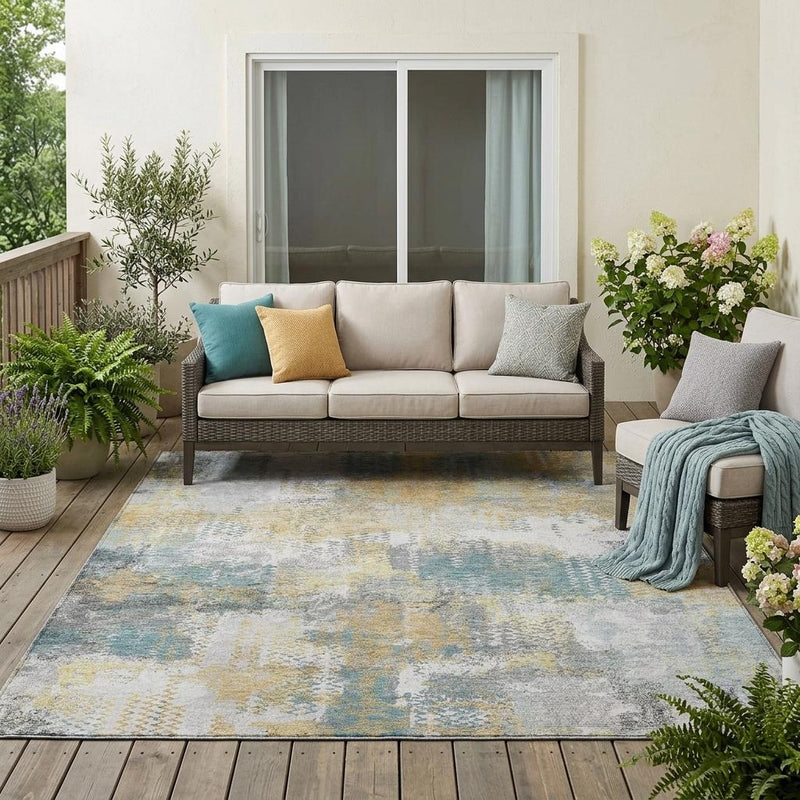 Abstract indoor outdoor area rug in silver gray with pale blue and yellow accents