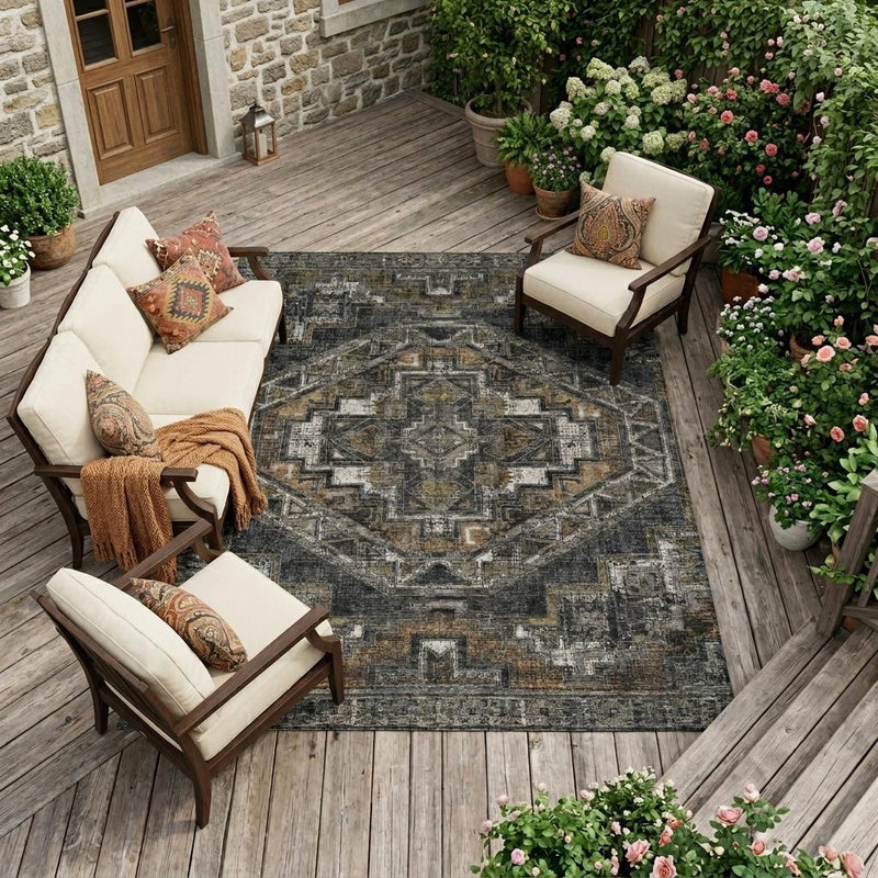 Southwestern area rug with central medallion and distressed geometric border in dark gray