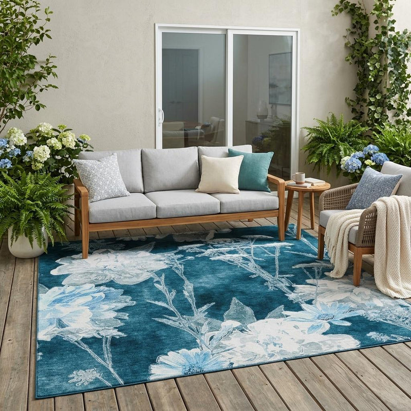 Teal and navy floral area rug with white botanical motifs