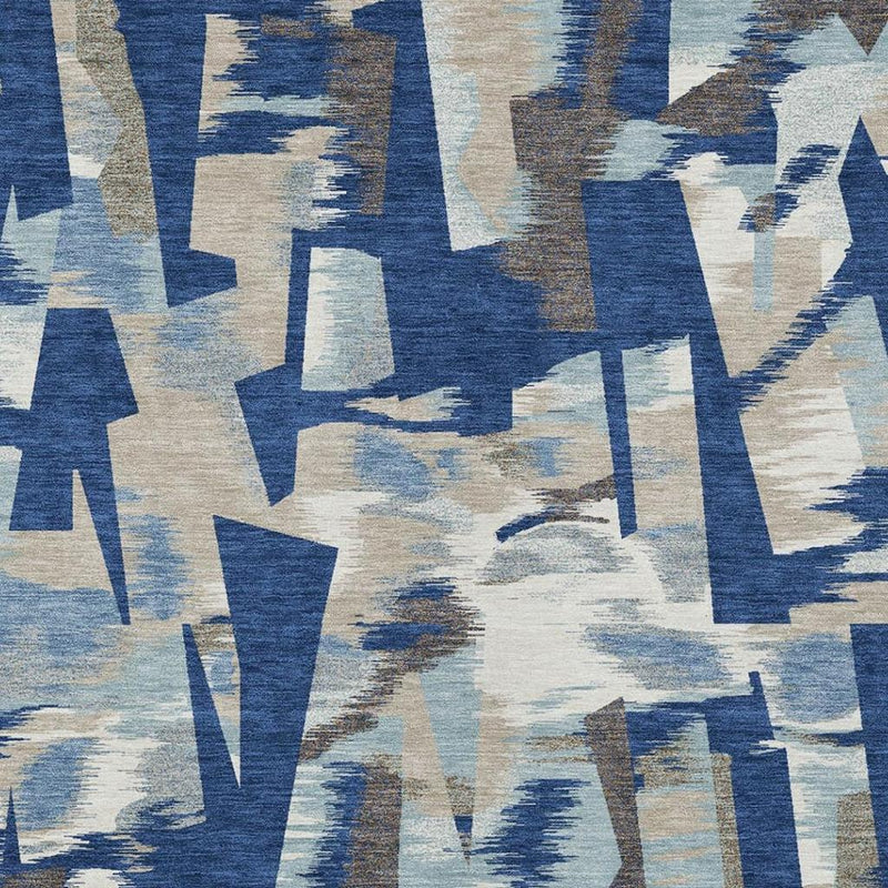 Blue and beige abstract area rug close-up with bold blocks and brushstroke shading