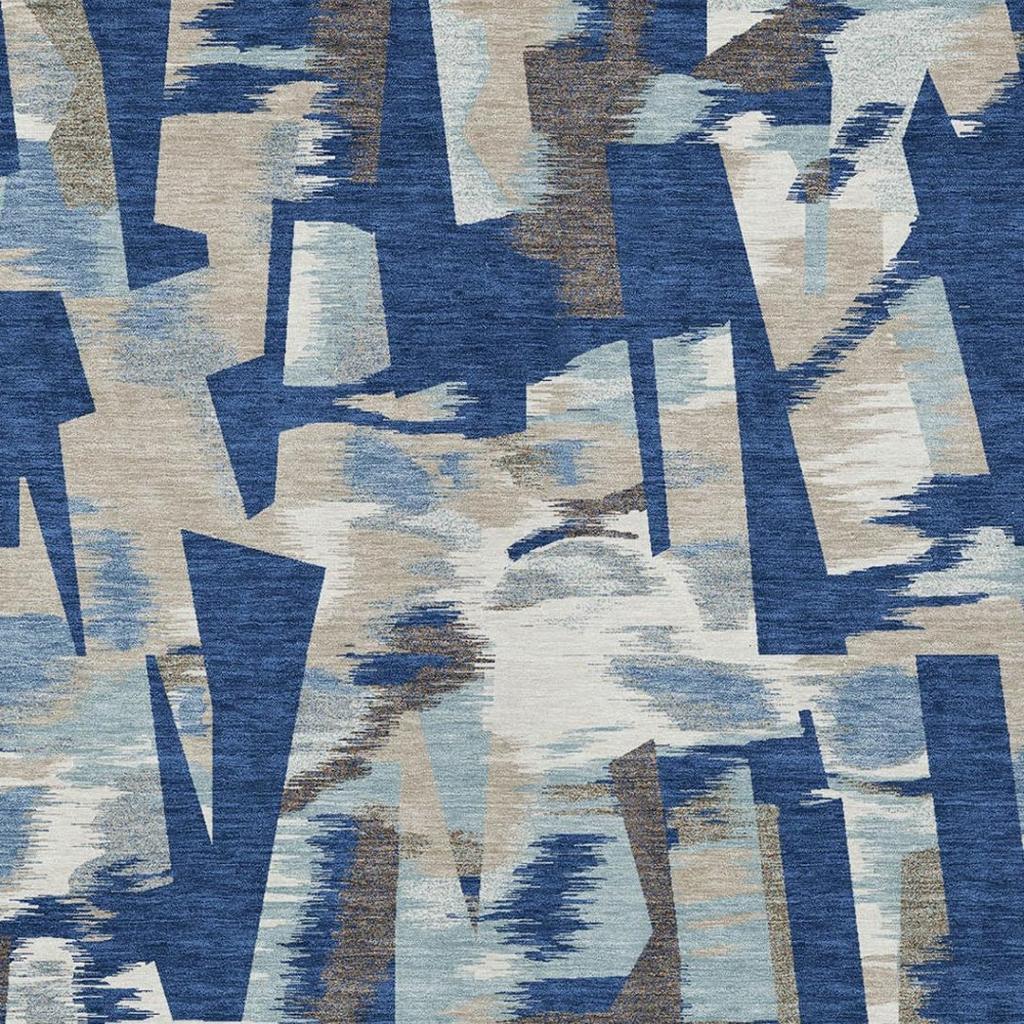 Blue and beige abstract area rug close-up of overlapping rectangular and arrow shapes