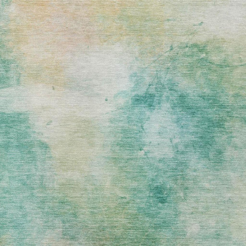 Aqua and teal abstract area rug with faded watercolor wash pattern and low-pile look.