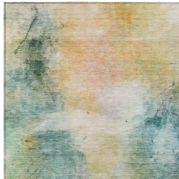 Abstract area rug with teal, peach and cream washed pattern, indoor/outdoor washable