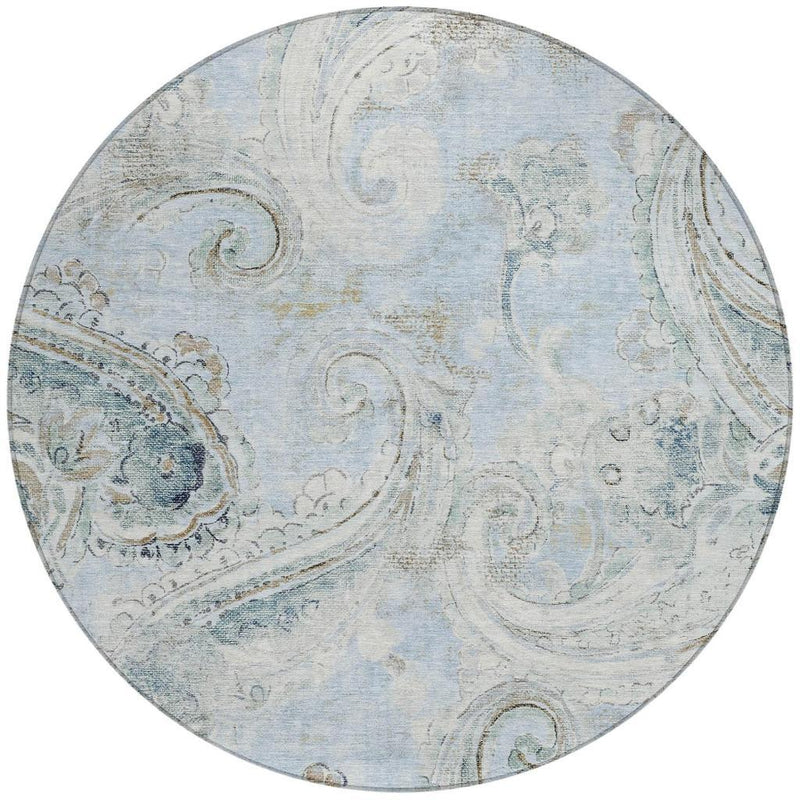 Round area rug with sky blue and muted blue paisley pattern, textured look