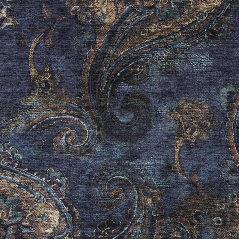 Navy blue rug with swirling paisley medallion and blue, tan, green accents