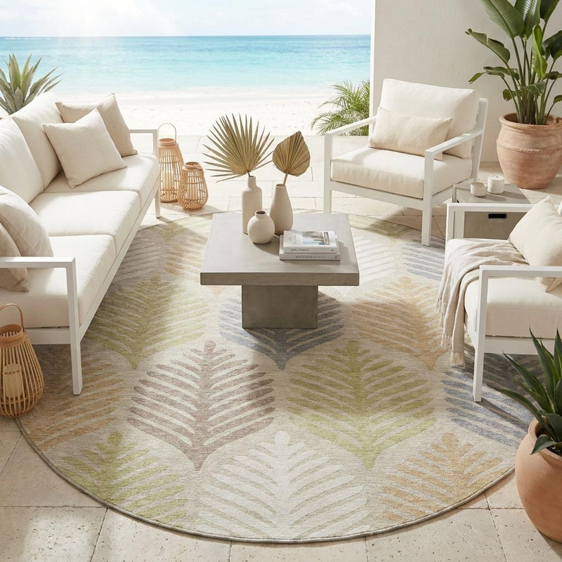 Beige and ivory round outdoor rug with colorful leaf motif and thin gray border