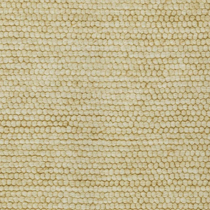 Close-up of wheat gold textured loop area rug surface