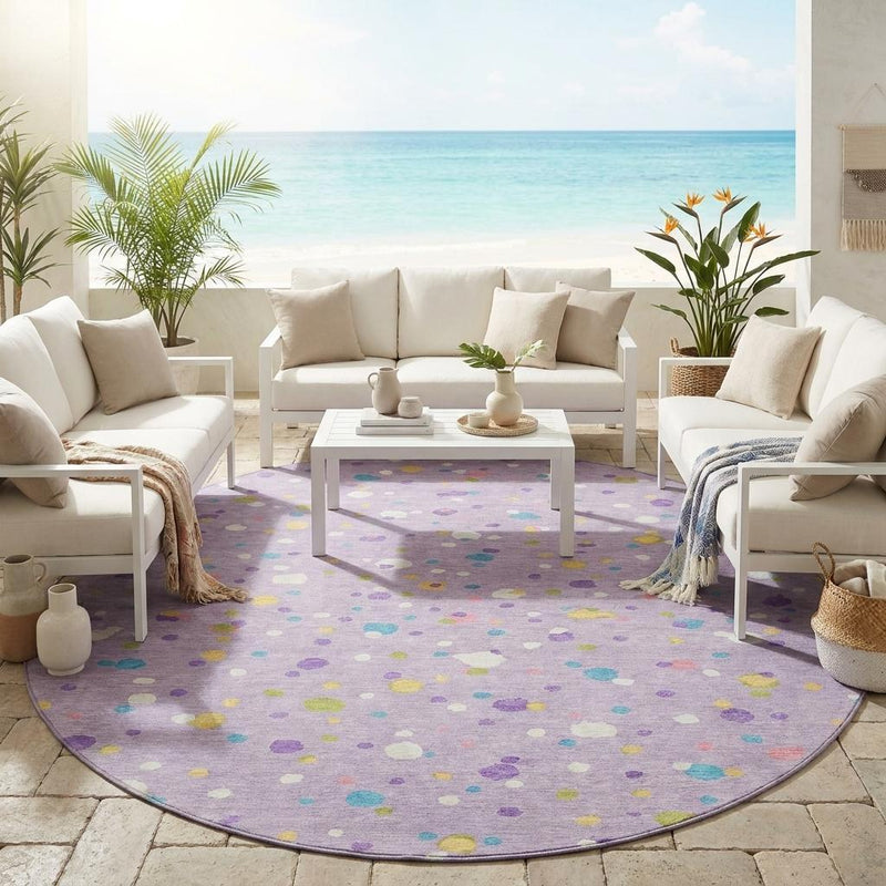 Round lavender rug with multicolor dot pattern in a living room setting
