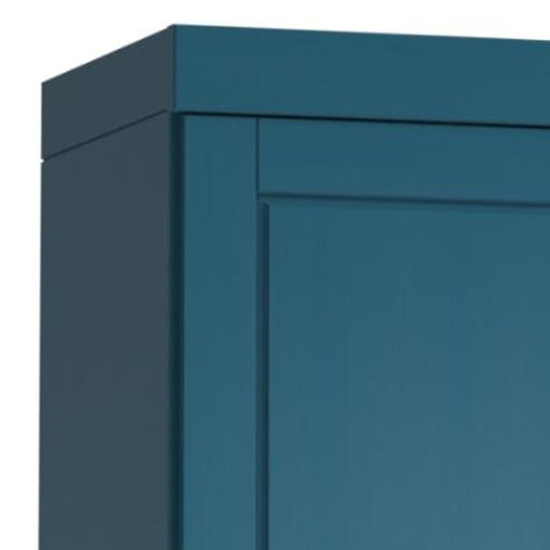 Teal cabinet door corner close-up with inset panel and raised trim detail.
