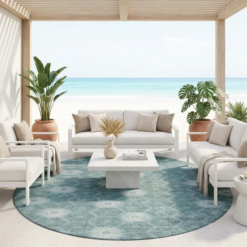 Round teal and ivory geometric area rug with repeating rosette and hexagon motifs