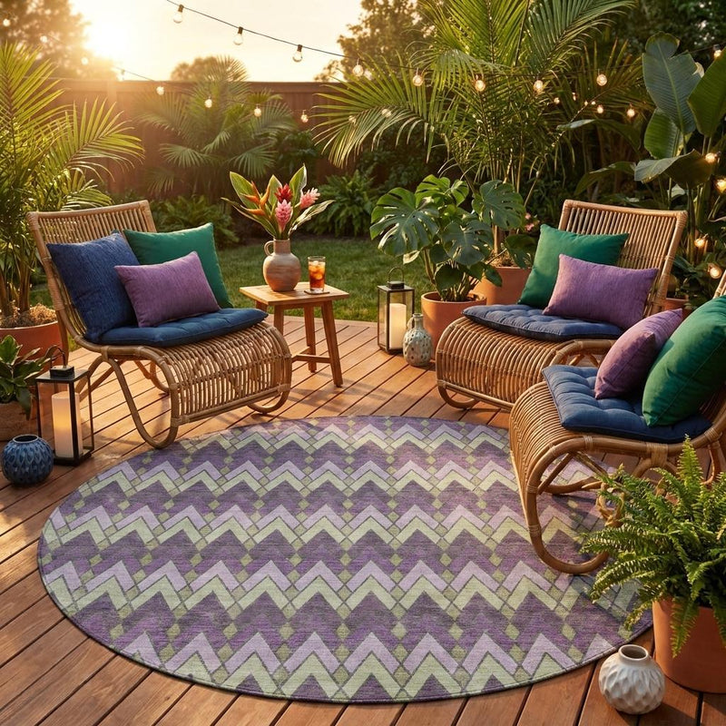 Round geometric area rug in purple and plum with chevron design