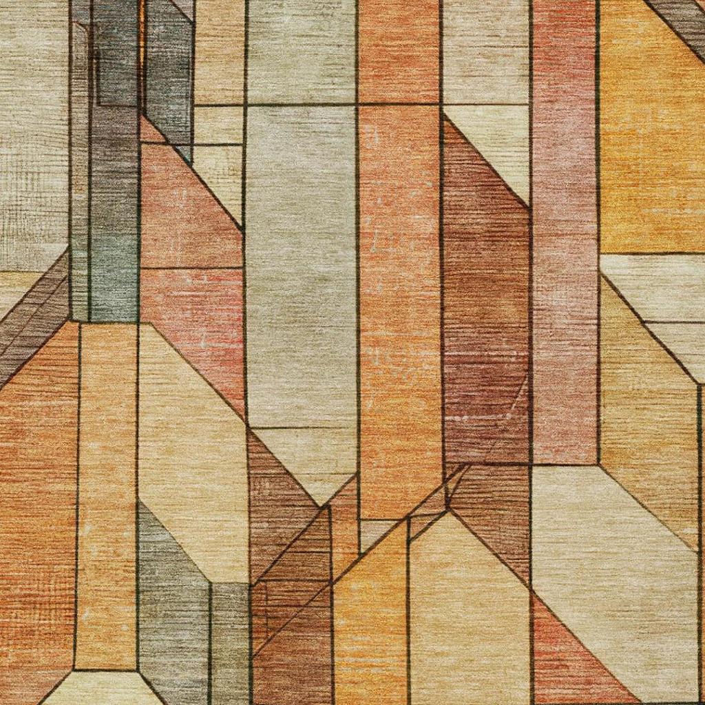 Geometric area rug close-up with stacked rectangular blocks in cream, orange, and gray