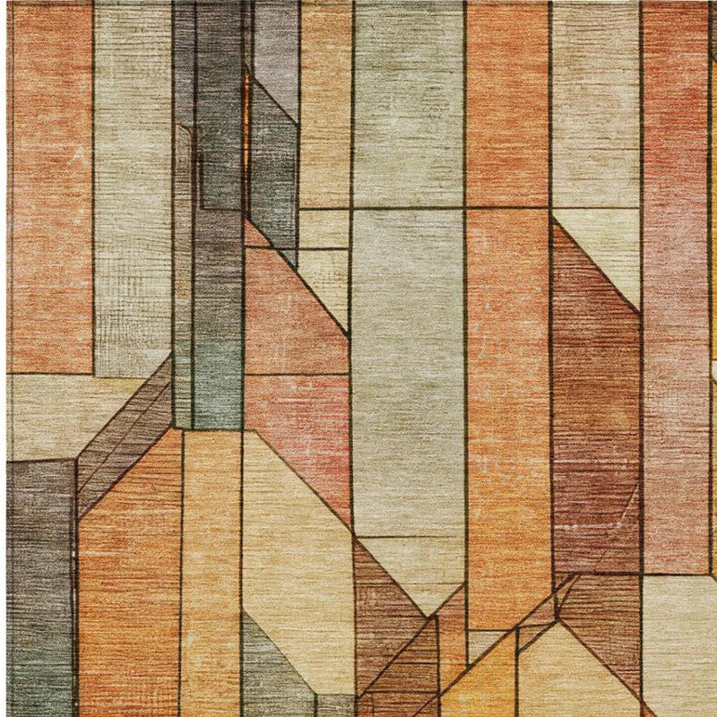 Geometric area rug close-up with vertical blocks in cream, orange, gray and muted green