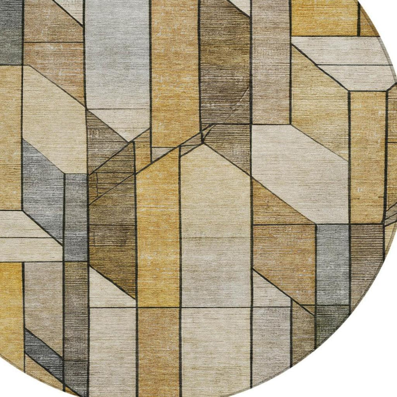 Round area rug featuring multicolor geometric blocks in beige, tan, brown, and gray