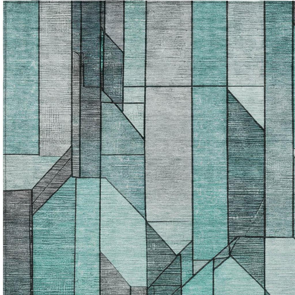 Square area rug with raised-looking block geometry in aqua teal, gray, and white