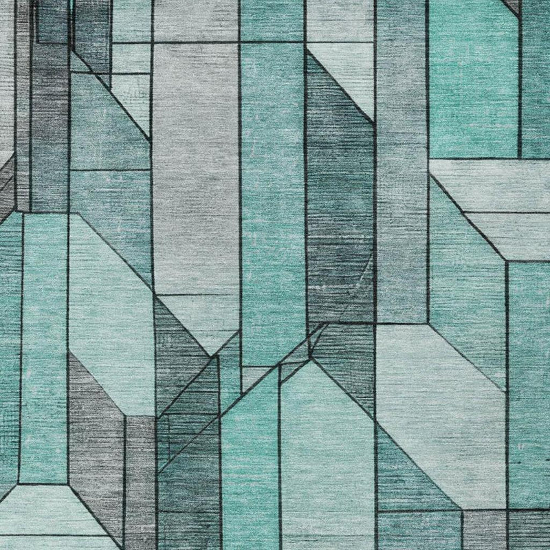 Indoor outdoor area rug featuring tall block columns in teal, aqua, gray, and white