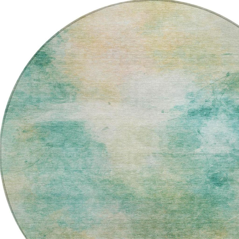 Round area rug close view of abstract aqua and teal watercolor texture