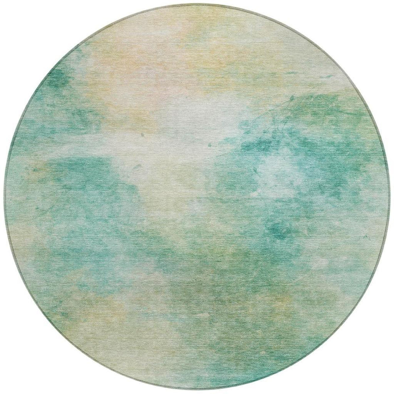 Round abstract aqua and teal area rug with thin tonal edge border