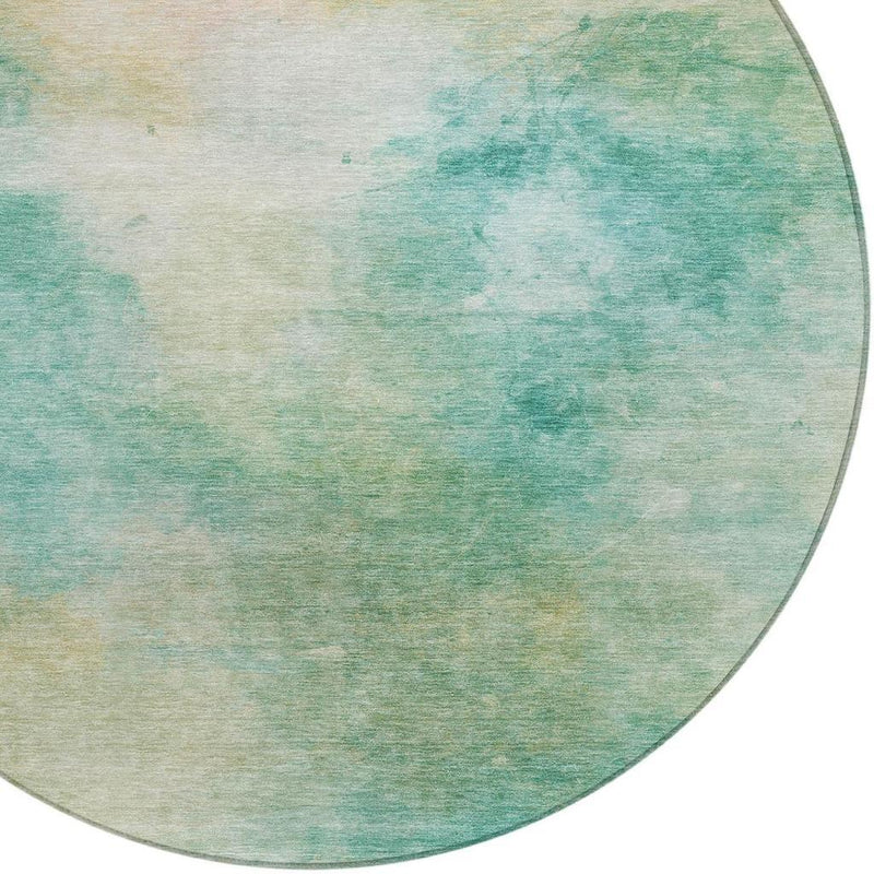 Round area rug with aqua and teal blended watercolor pattern, bordered edge