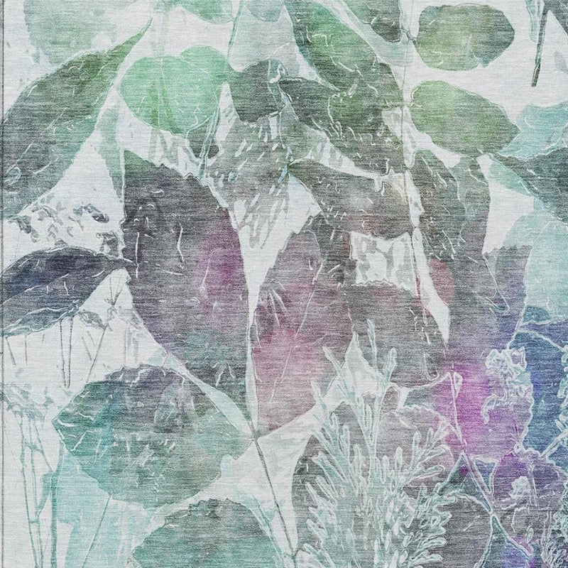 Teal and silver botanical leaf area rug with abstract watercolor leaves and branching stems