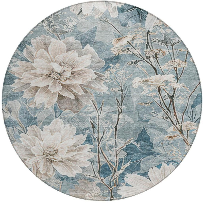 Round area rug featuring cream floral blooms over teal blue background