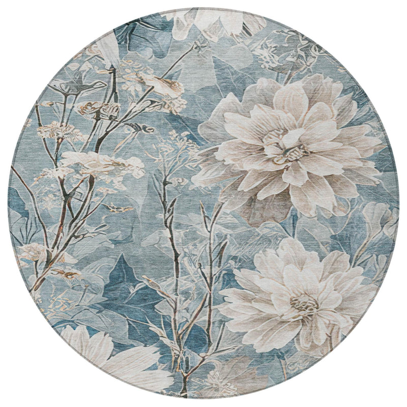 Round area rug with large cream flowers and teal blue botanical vines