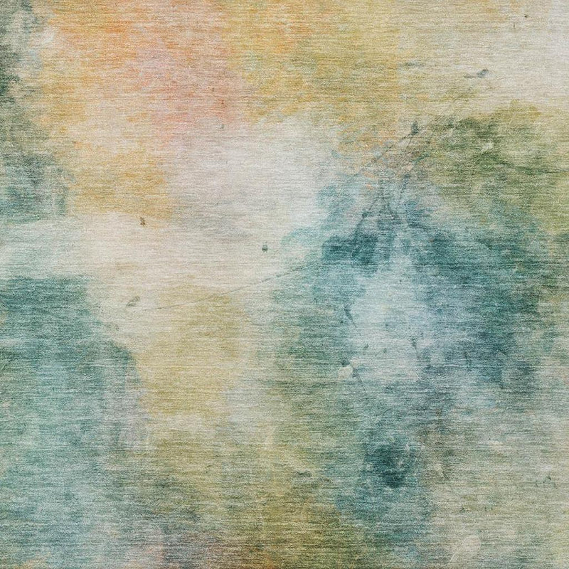 Abstract area rug close-up: teal blue, green, and peach hues on a light ground