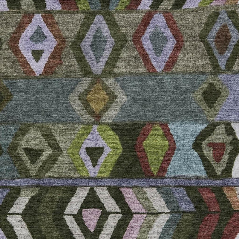 Geometric area rug close-up with multicolor diamond pattern on gray-green ground