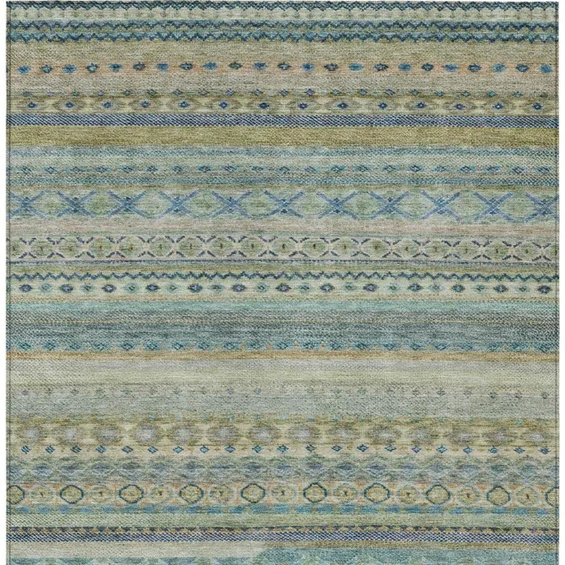 Striped area rug surface with blue, green, and tan bands and repeating symbols.