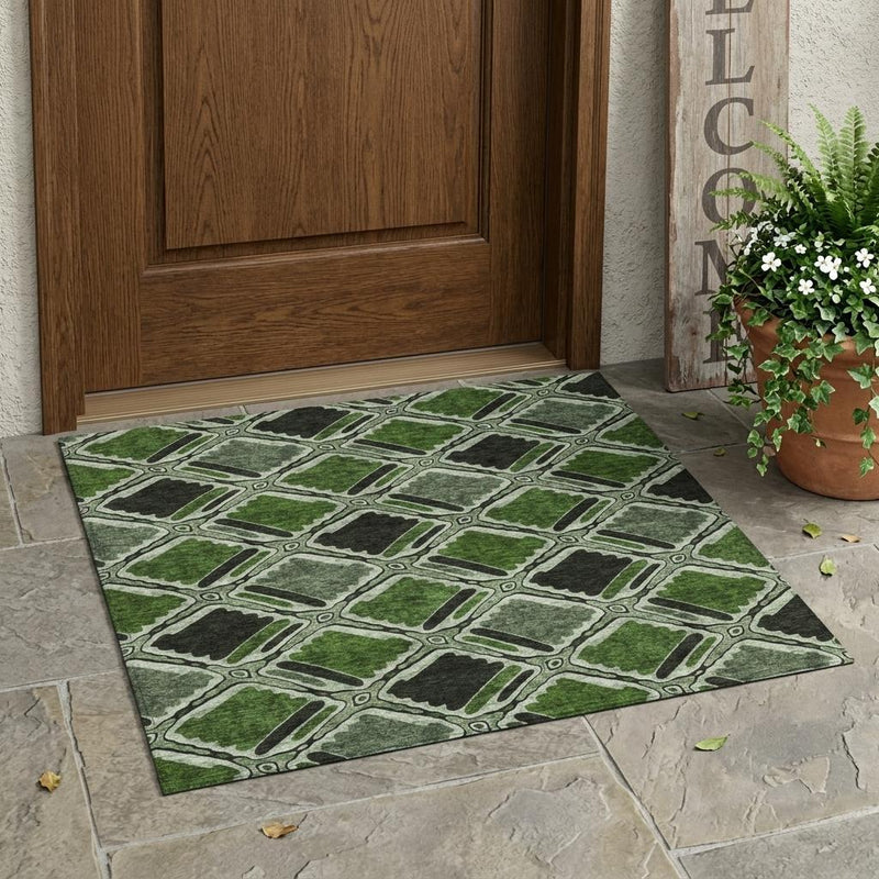 Indoor outdoor area rug with diamond geometric motif in green and dark gray