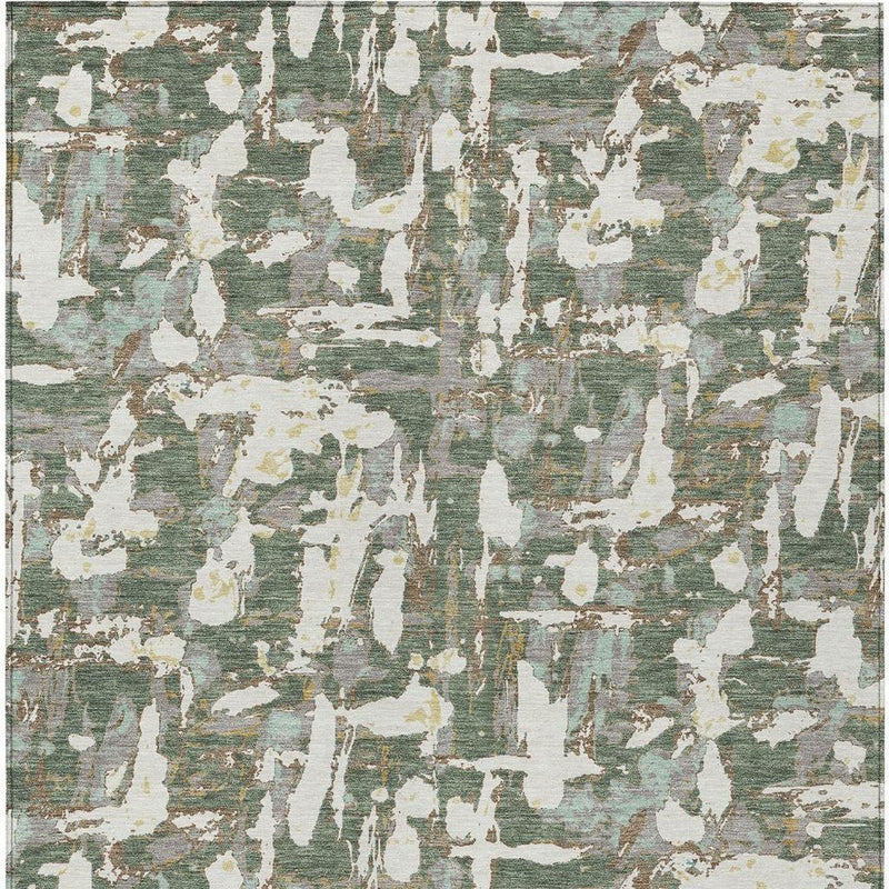 Green and beige abstract area rug flat surface with irregular white drips and lines
