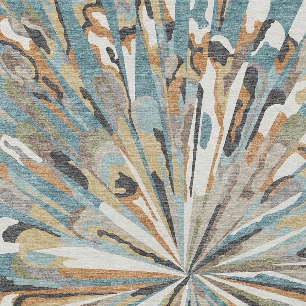Teal blue and beige abstract area rug close-up with radial fan rays and textured weave