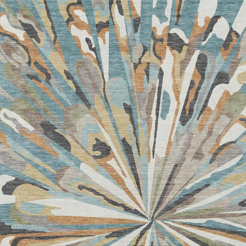 Teal blue and beige abstract area rug close-up with radial fan rays and textured weave