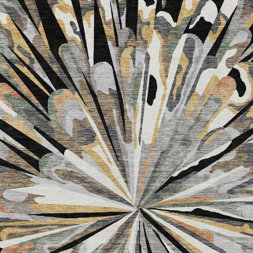 Abstract area rug close-up with radial lines and center rosette in black, gray, and tan.